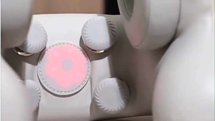 close up of infra-red heat lights and massage nodes of premium smart travel pillow